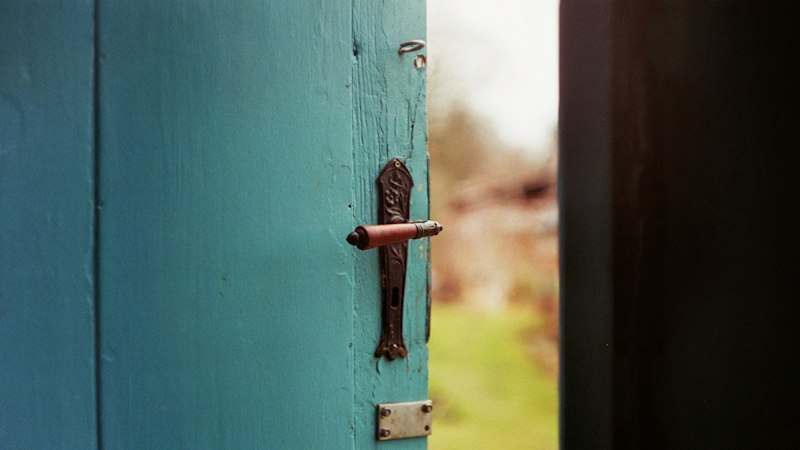 Close-up of a closed blue wooden door